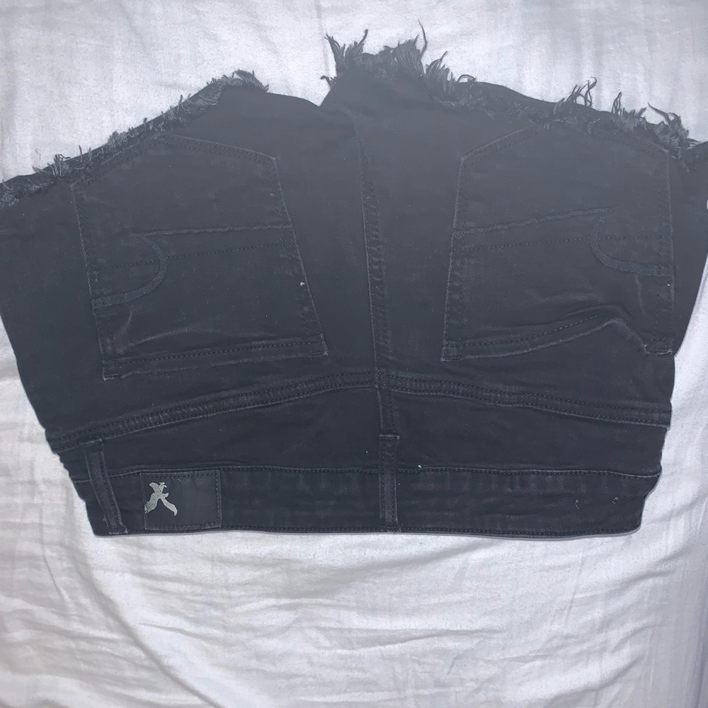 Black low rise fringed shorts American eagle
